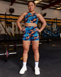 Woman wearing AMRAP High Neck Sports Bra - React Print | Model:Vana | Size:M | Thumbnail Index: 2