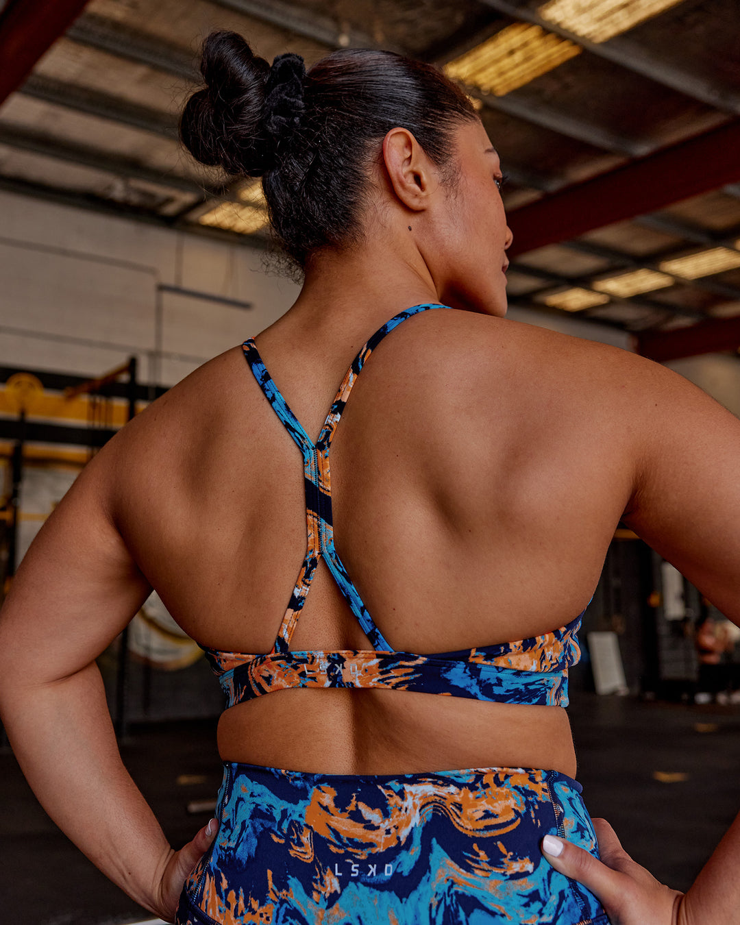 Woman wearing AMRAP High Neck Sports Bra - React Print | Model:Vana | Size:M - view 2
