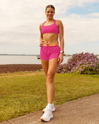 Woman wearing Accelerate 3" Running Short - Ultra Pink | Model:Phoebe | Size:M | Thumbnail Index: 3