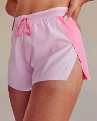 Woman wearing Accelerate 3" High-Rise Running Short - Candy Pink-Marshmallow | Set:true | Angle:closeup | Size:M | Thumbnail Index: 0