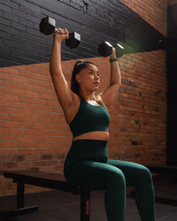 Woman wearing Accelerate Sports Bra - Dark Moss | Model:Gloria | Size:M | Thumbnail Index: 3