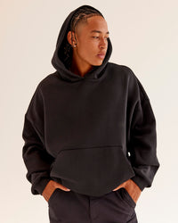 Man wearing AfterDark ZeroCrease Oversized Hoodie - Black | Model:Malebo | Size:M | Thumbnail Index: 1