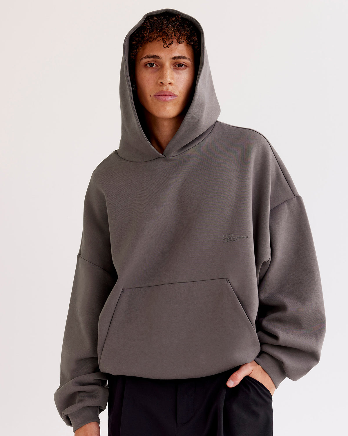 Man wearing AfterDark ZeroCrease Oversized Hoodie - Duskstone | Model:Leandro | Size:M