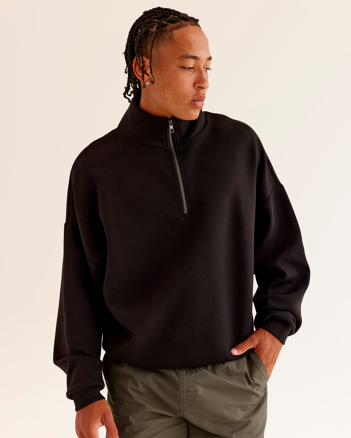 Man wearing AfterDark ZeroCrease Quarter Zip - Black | Model:Malebo | Size:M