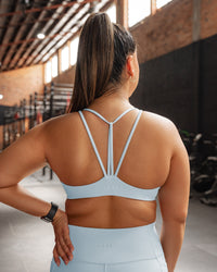 Woman wearing Agile Sports Bra - Skyride | Model:Gloria | Size:M | Thumbnail Index: 2