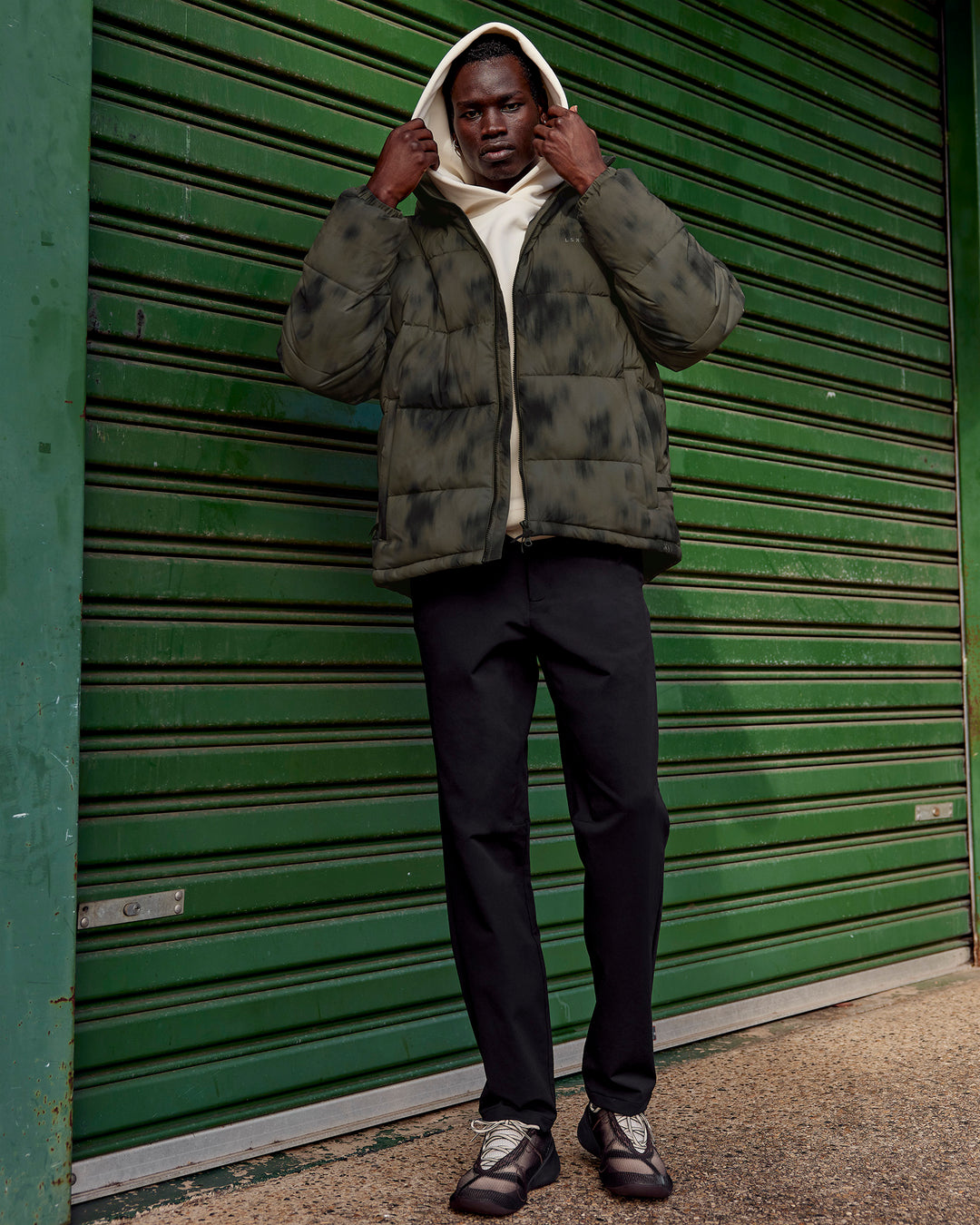 Man wearing Base Puffer Jacket - Camo Washed Walnut Grey | Model:Mabyro | Size:M - view 4