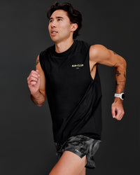 Man wearing Cadence RUN CLUB Muscle Tank - Black-Yellow Fizz | Model:Jared | Size:M | Thumbnail Index: 1