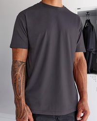 Man wearing Forever EffortlessTech Tee - Dark Storm | Model:Daarian | Size:M | Thumbnail Index: 0