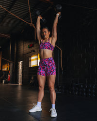 Woman wearing Fusion High-Rise 4" Short Pockets - Pink Luminous | Model:Teraipine | Size:M | Thumbnail Index: 2