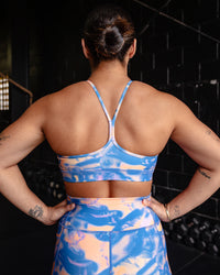 Woman wearing Lift High Neck Sports Bra - Apricot Mist | Model:Tiare | Size:M | Thumbnail Index: 1
