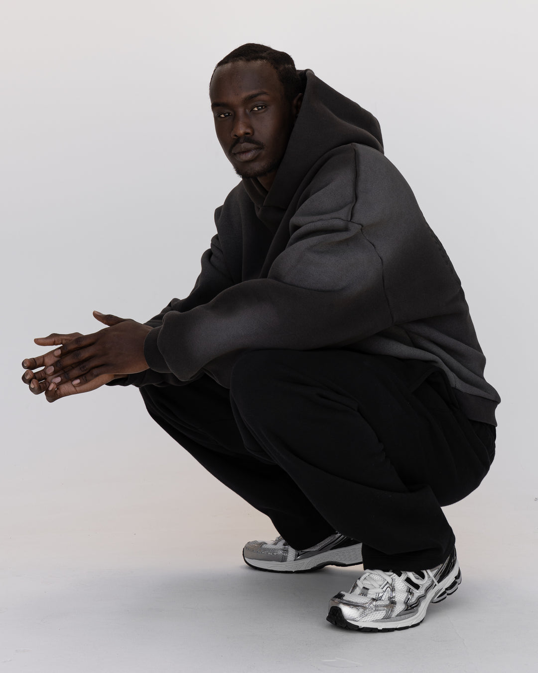 Man wearing Memory In Motion 500gsm Ultra Heavyweight Washed Hoodie - Charcoal Washed | Model:Okello | Size:M - view 8