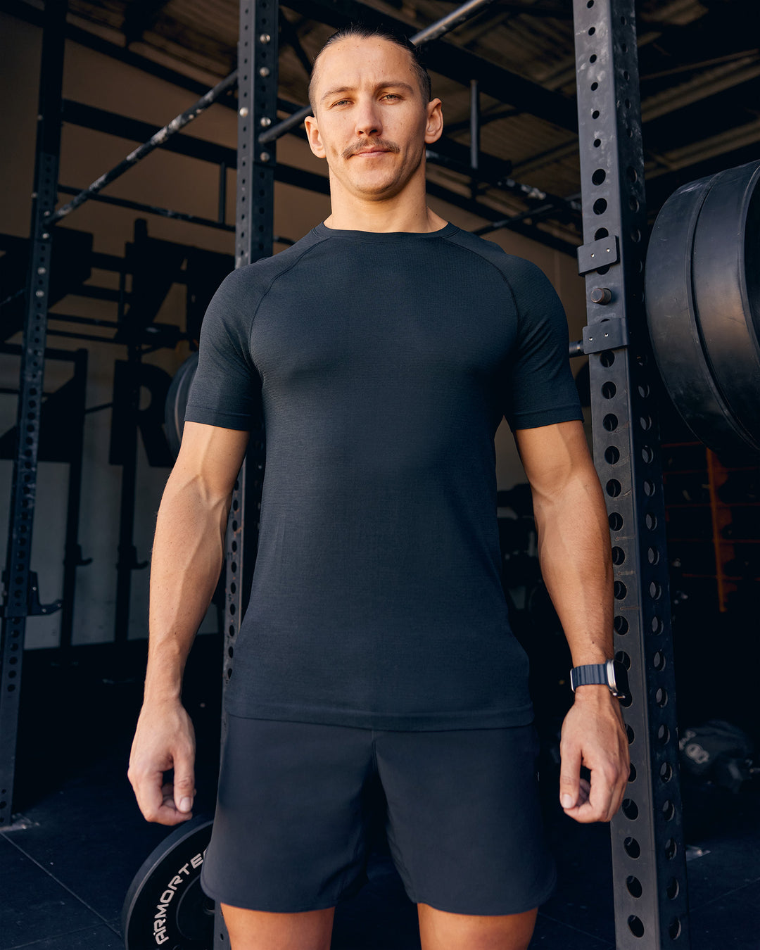 Man wearing AeroFLX+ Seamless Tee - Black Marl | Model:Jaiden | Size:M - view 3