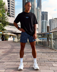 Man wearing Pace 5" Lined Running Short - Energy Print Palace Blue | Model:Malebo | Size:M | Thumbnail Index: 3