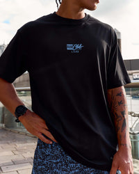 Man wearing Run Club Script FLXCotton Oversized Tee - Black-Palace Blue | Model:Malebo | Size:M | Thumbnail Index: 5