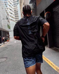 Man wearing Run Club Script FLXCotton Oversized Tee - Black-Palace Blue | Model:Malebo | Size:M | Thumbnail Index: 2