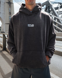 Man wearing Runner’s Unisex Oversized Hoodie - Black Washed-White | Model:Drew | Size:M | Thumbnail Index: 1