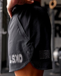 Man wearing Static Grit Lift 6" Short - Black-Alloy | Model:Jaiden | Size:M | Thumbnail Index: 2