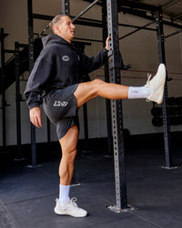 Man wearing Static Grit Lift 6" Short - Black-Alloy | Model:Jaiden | Size:M | Thumbnail Index: 1