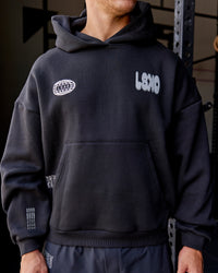 Man wearing Static Grit Unisex Boxy Hoodie - Black-Alloy | Model:Jaiden | Size:M | Thumbnail Index: 1