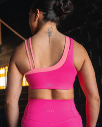 Woman wearing Thrive Asymmetric Sports Bra - Ultra Pink-Candy Pink | Model:Teraipine | Size:M | Thumbnail Index: 8