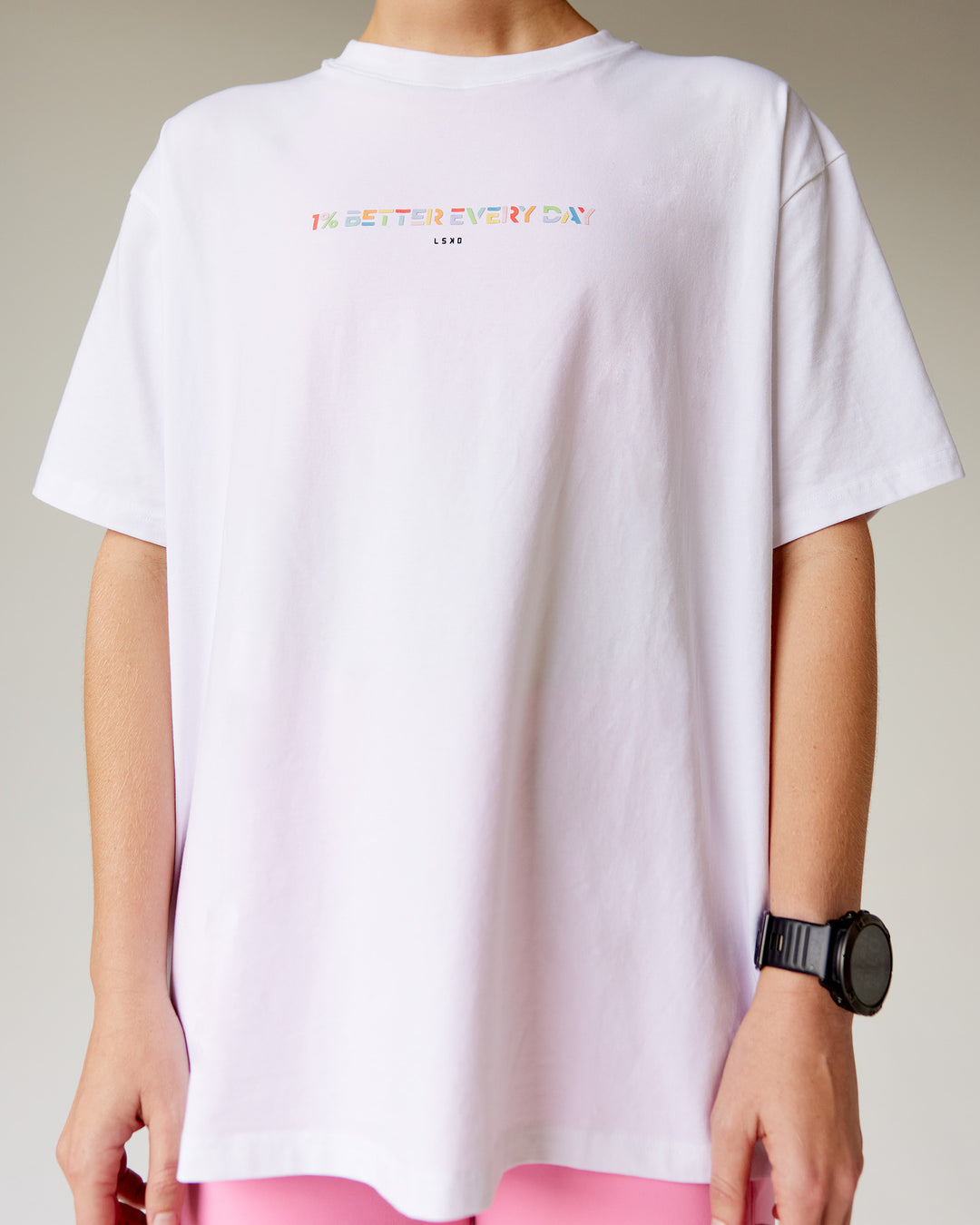 Woman wearing Unity Go-To FLX Cotton Tee - White-Rainbow | Model:Adi | Size:M - view 1