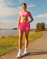 Woman wearing Velocity Sports Bra - Ultra Pink | Model:Phoebe | Size:M | Thumbnail Index: 2