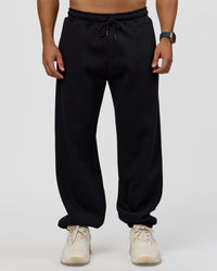 Man wearing Static Grit Baggy Track Pant - Black-Alloy | Model:Jaiden | Size:M | Thumbnail Index: 5