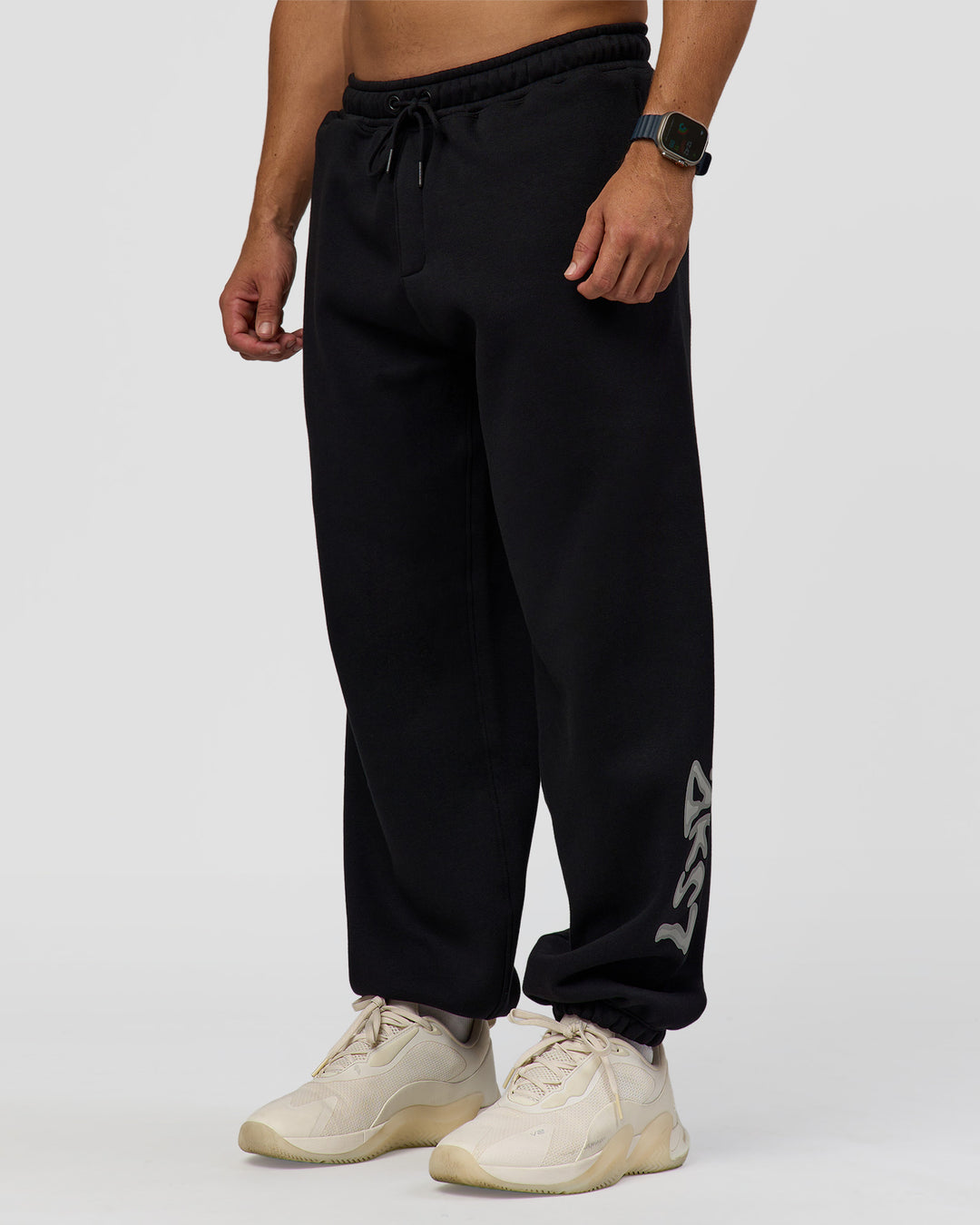 Man wearing Static Grit Baggy Track Pant - Black-Alloy | Model:Jaiden | Size:M - view 7