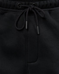 Man wearing Static Grit Baggy Track Pant - Black-Alloy | Model:Jaiden | Size:M | Thumbnail Index: 4