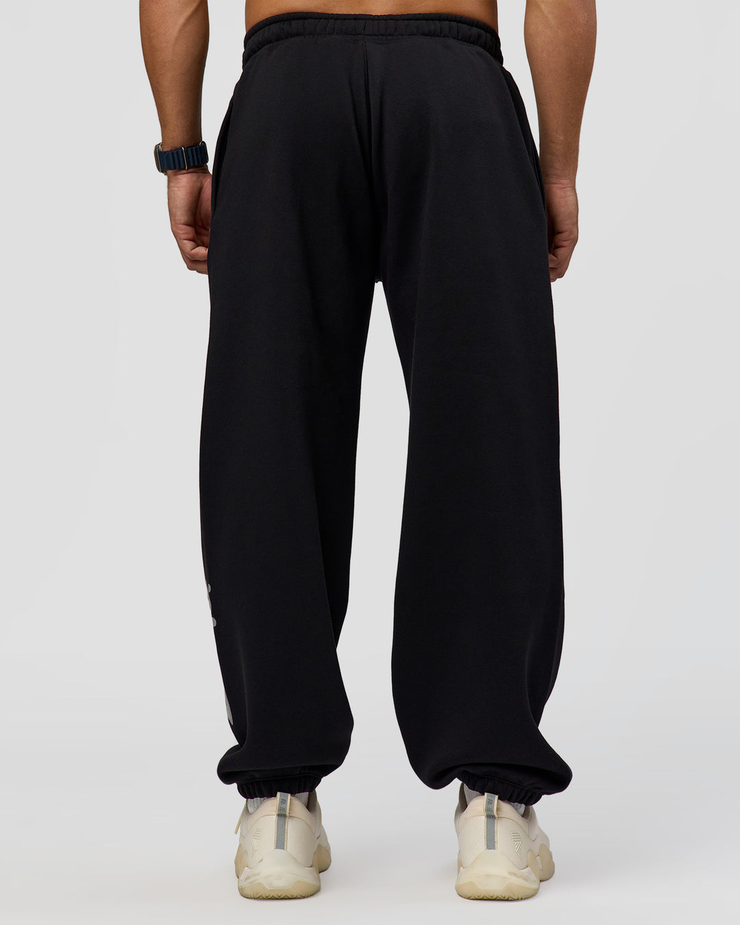 Man wearing Static Grit Baggy Track Pant - Black-Alloy | Model:Jaiden | Size:M - view 4