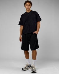 Man wearing 86 V-Neck Oversized Tee - Black-Black | Model:Leandro | Size:M | Thumbnail Index: 5
