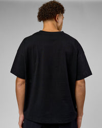 Man wearing 86 V-Neck Oversized Tee - Black-Black | Model:Leandro | Size:M | Thumbnail Index: 3