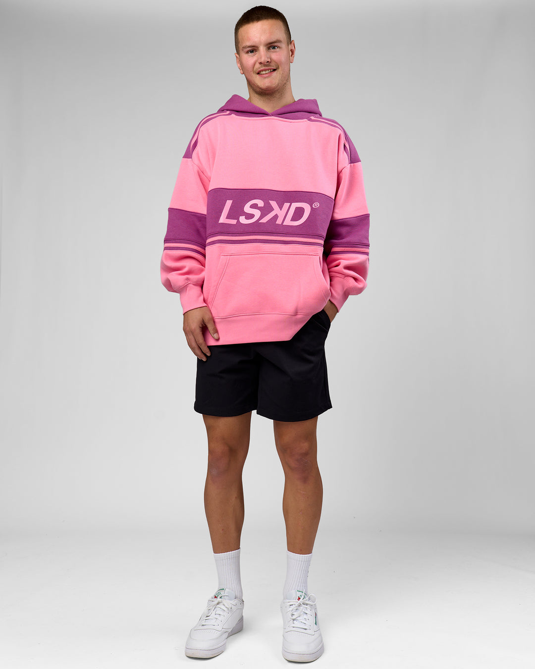 Man wearing A-Team Oversized Hoodie - Candy Pink-Boysenberry | Model:Arran | Size:M - view 8