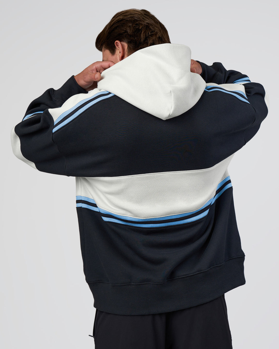 Man wearing A-Team Oversized Hoodie - Caviar-Open Air | Model:Konnor | Size:M - view 5