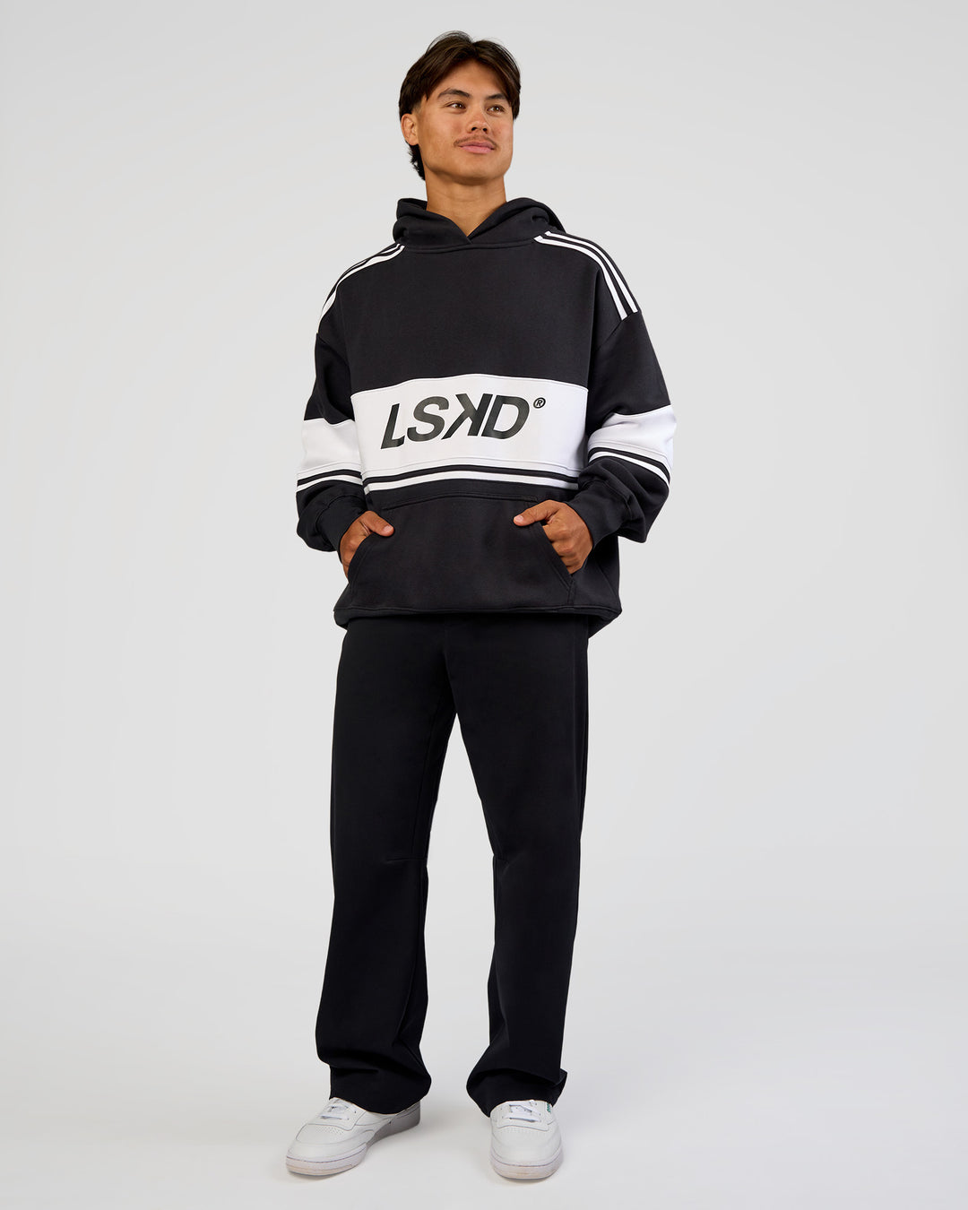 Man wearing A-Team Oversized Hoodie - Caviar-White | Model:George | Size:M - view 10