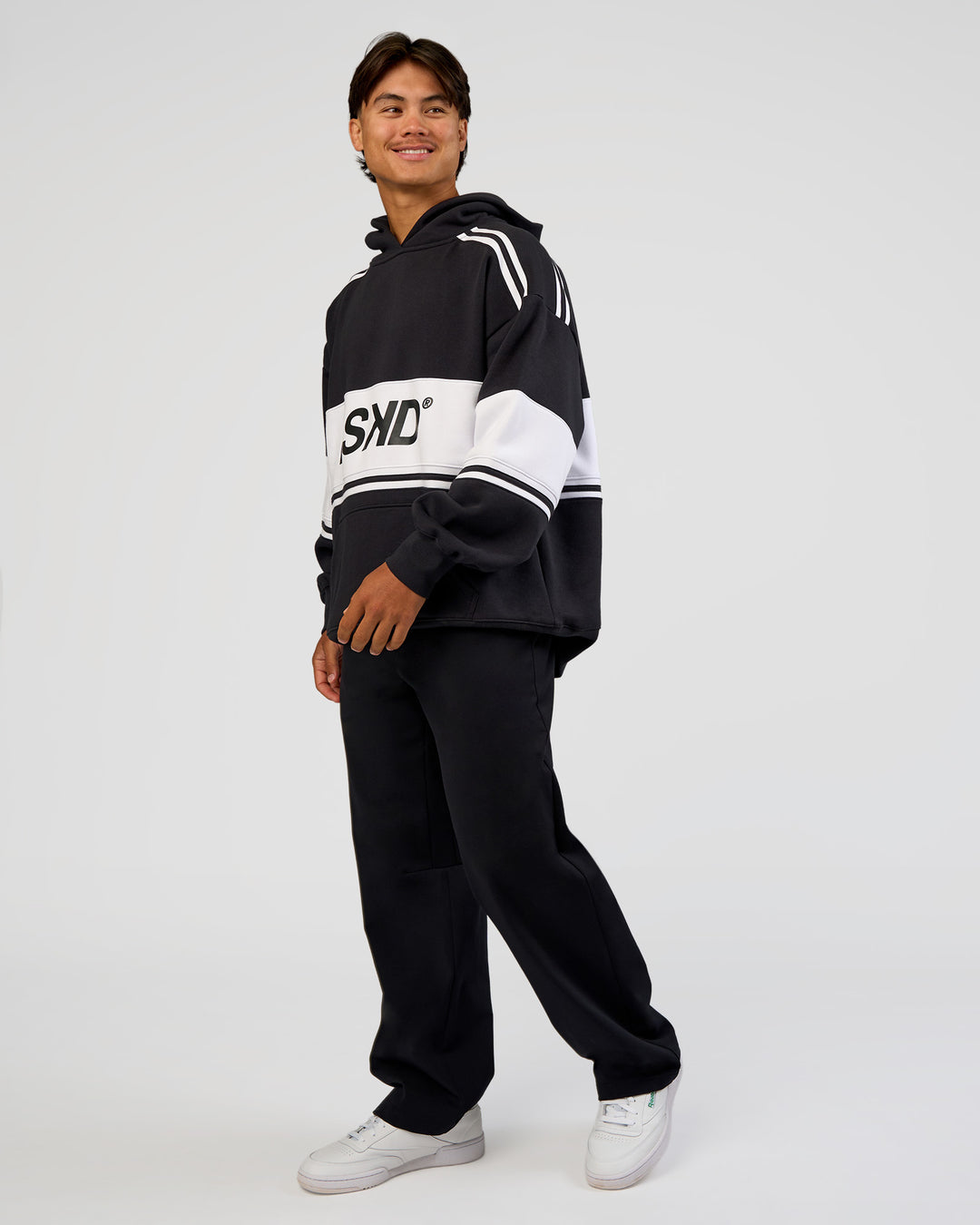 Man wearing A-Team Oversized Hoodie - Caviar-White | Model:George | Size:M - view 3