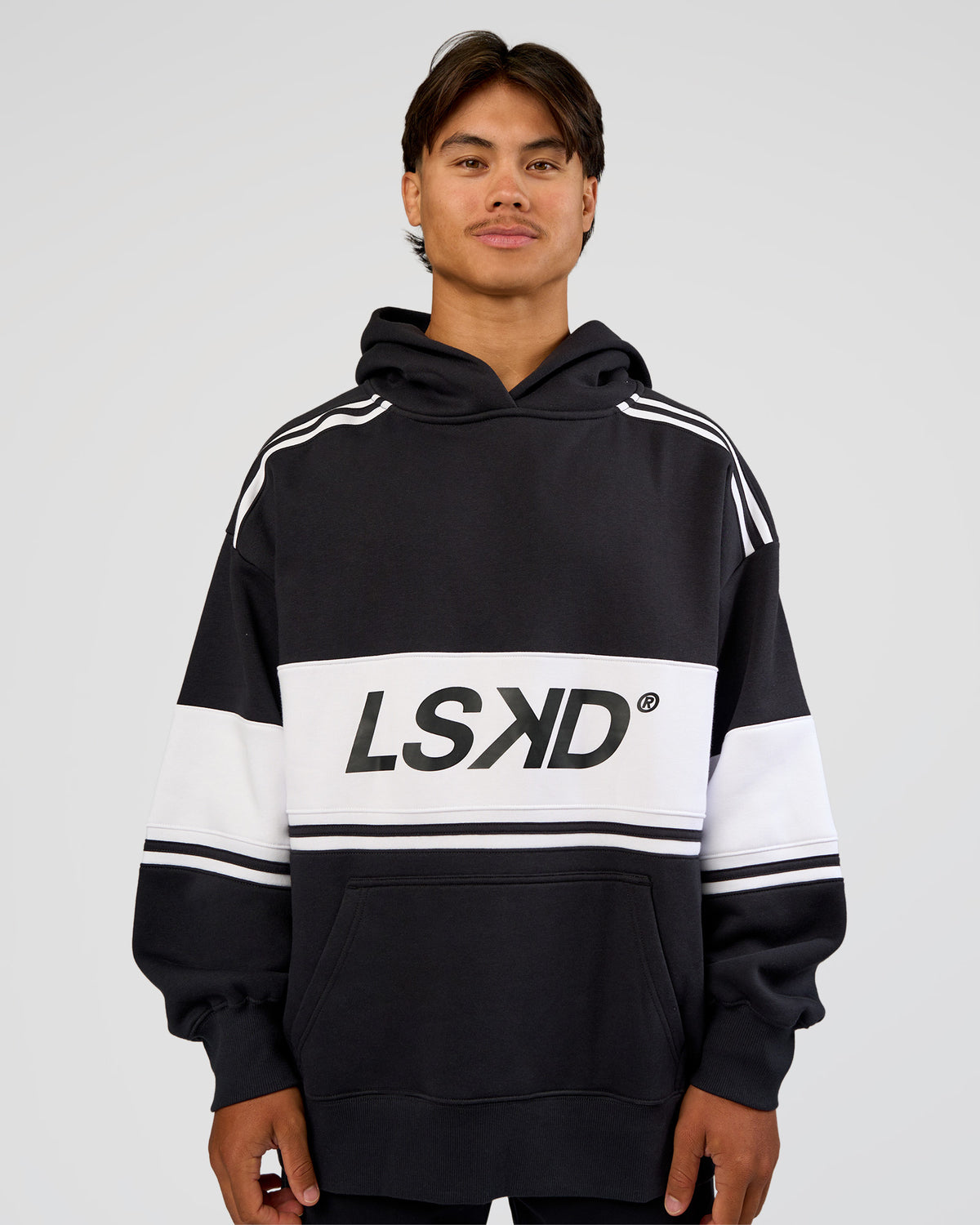 Man wearing A-Team Oversized Hoodie - Caviar-White | Model:George | Size:M