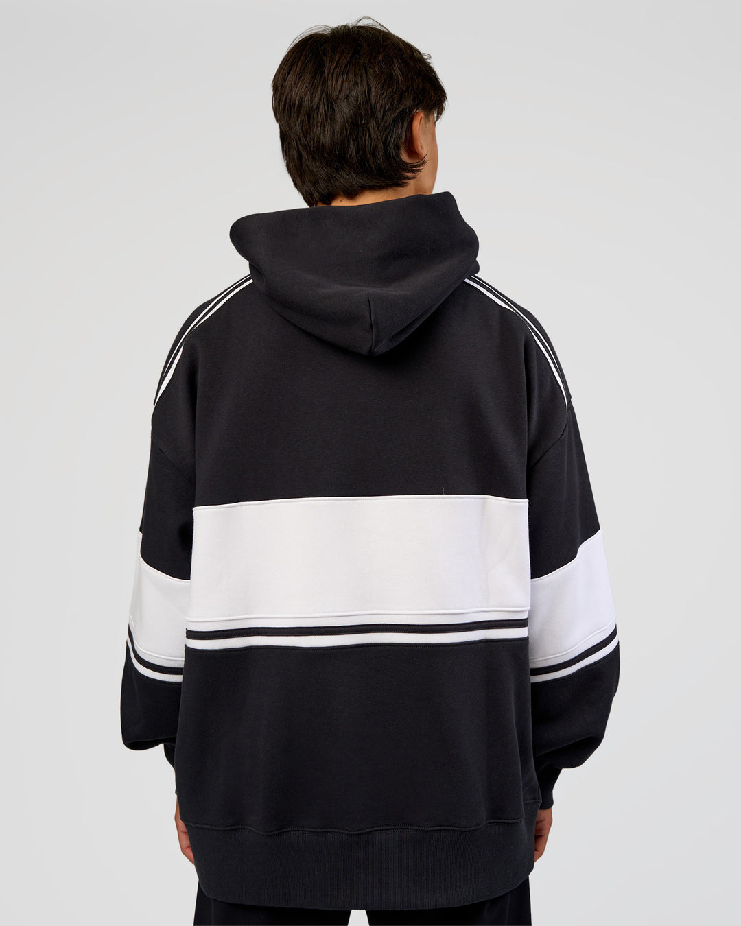 Man wearing A-Team Oversized Hoodie - Caviar-White | Model:George | Size:M - view 6