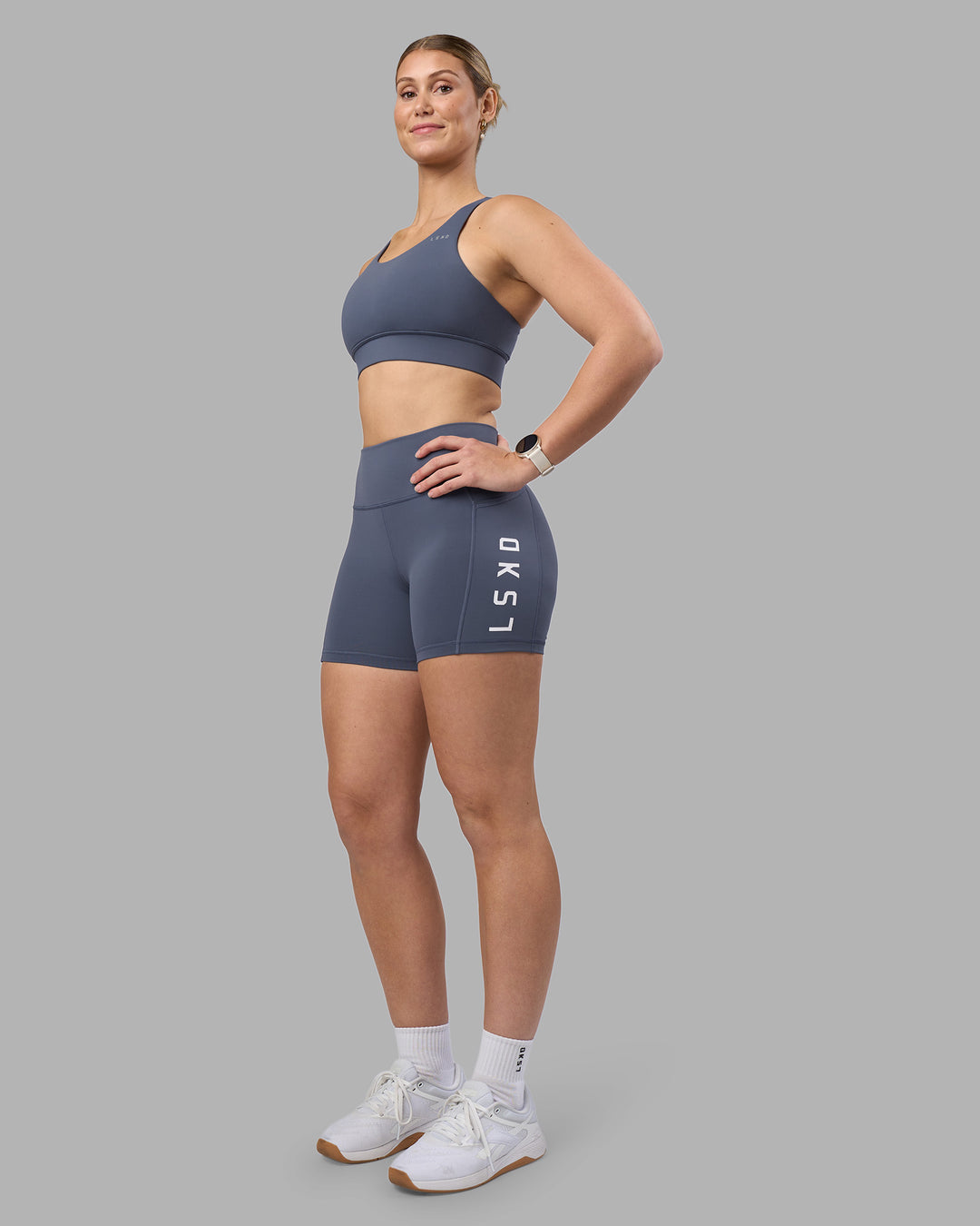 Woman wearing Accelerate Sports Bra - Night Shadow | Model:Amy | Size:M - view 3