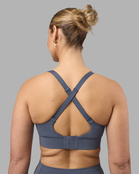 Woman wearing Accelerate Sports Bra - Night Shadow | Set:true | Angle:back | Model:Amy | Size:M | Thumbnail Index: 1
