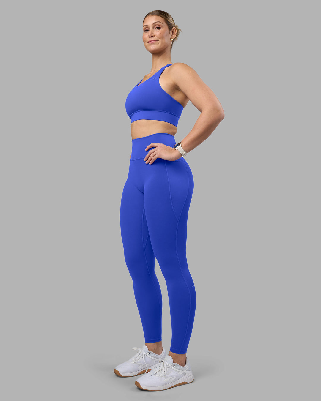 Woman wearing Accelerate Sports Bra - Power Cobalt | Model:Amy | Size:M - view 3