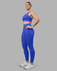 Woman wearing Accelerate Sports Bra - Power Cobalt | Model:Amy | Size:M | Thumbnail Index: 2