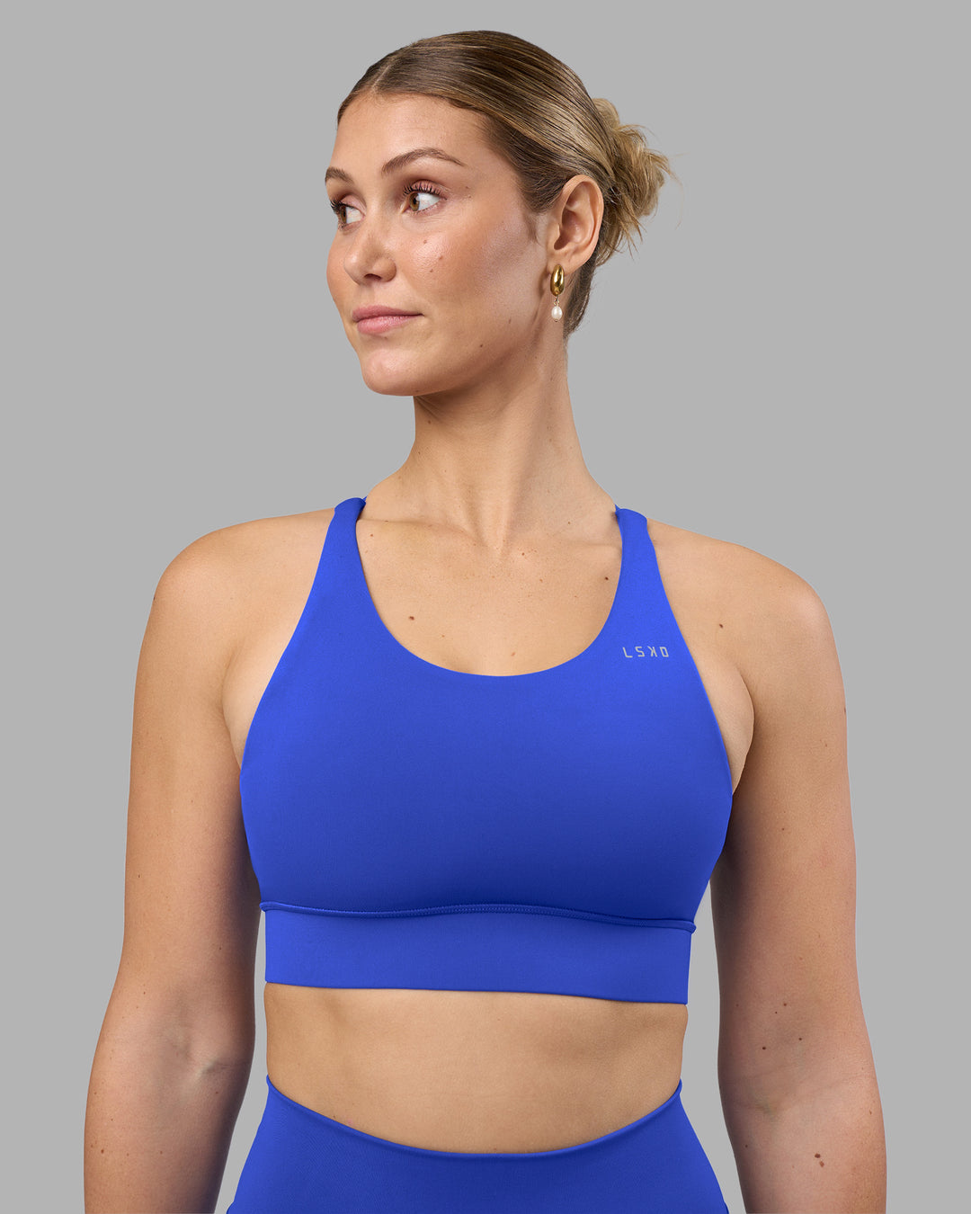 Woman wearing Accelerate Sports Bra - Power Cobalt | Model:Amy | Size:M - view 5