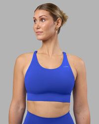 Woman wearing Accelerate Sports Bra - Power Cobalt | Model:Amy | Size:M | Thumbnail Index: 4