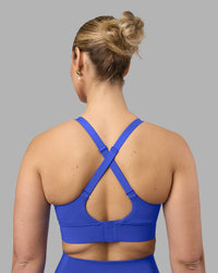 Woman wearing Accelerate Sports Bra - Power Cobalt | Model:Amy | Size:M | Thumbnail Index: 1