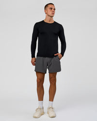 Man wearing AeroFLX+ Seamless Long Sleeve Tee (Set in Sleeve) in Black/Black | Model:Albert | Size:M | Thumbnail Index: 5