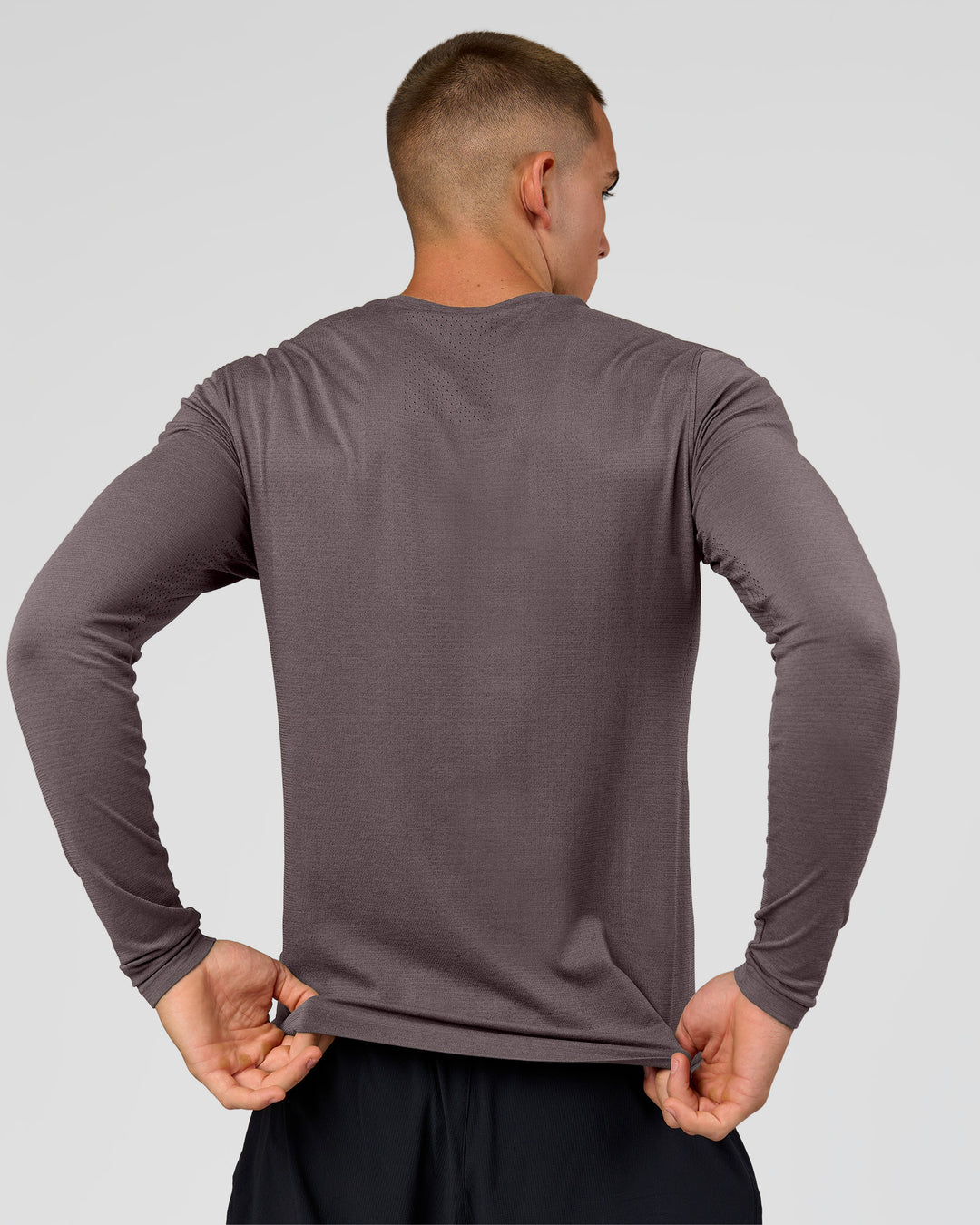 Man wearing AeroFLX+ Seamless Long Sleeve Tee (Set in Sleeve) in Duskstone/Duskstone | Model:Albert | Size:M - view 3