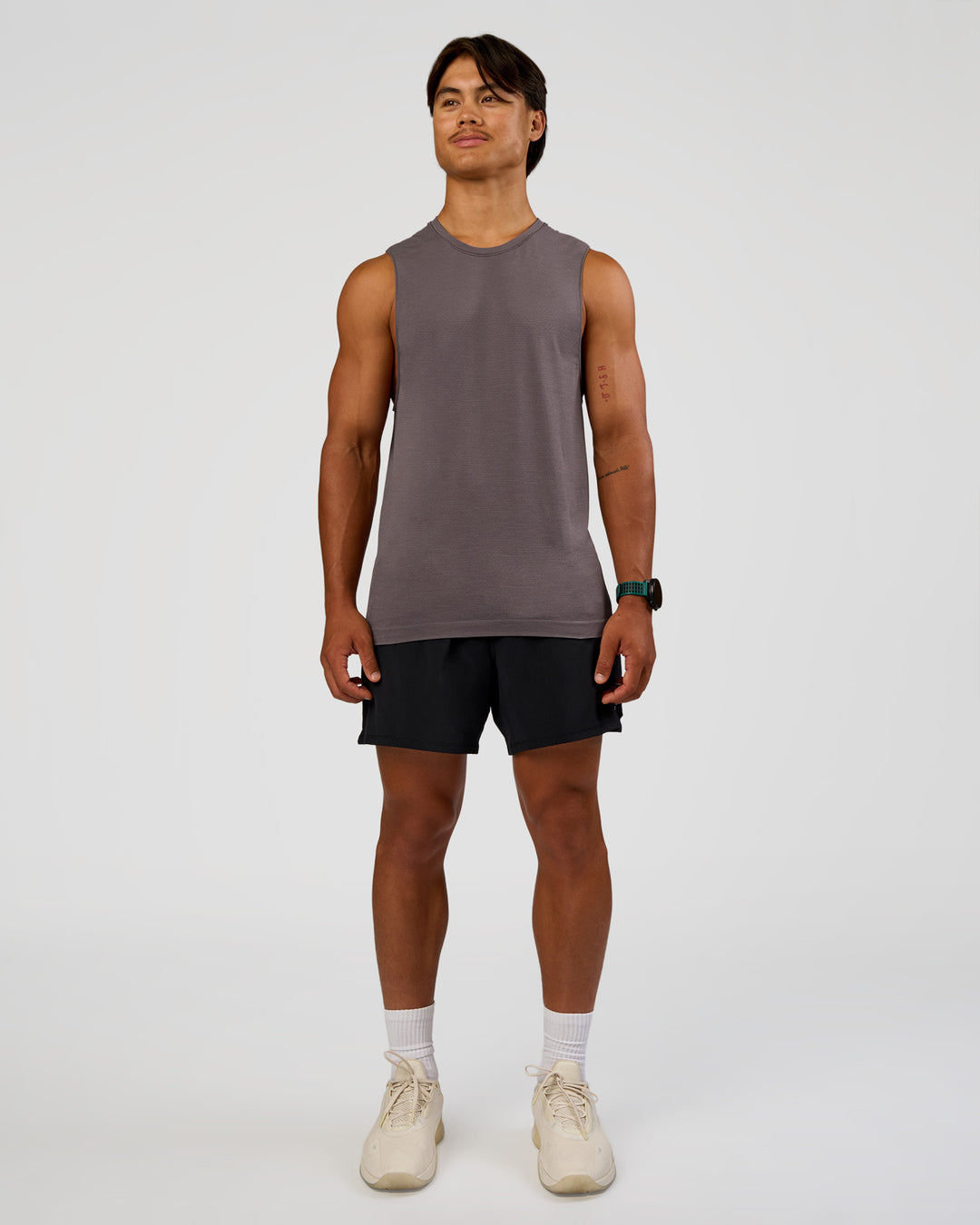 Man wearing AeroFLX+ Seamless Muscle Tank - Duskstone/Duskstone | Model:George | Size:M - view 6