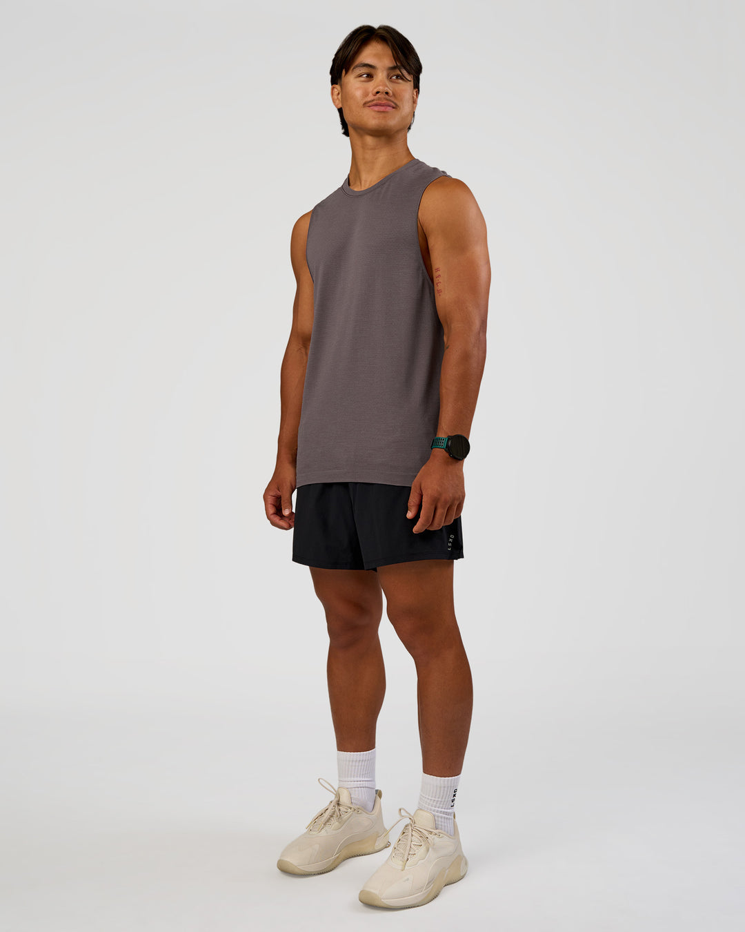 Man wearing AeroFLX+ Seamless Muscle Tank - Duskstone/Duskstone | Model:George | Size:M - view 2