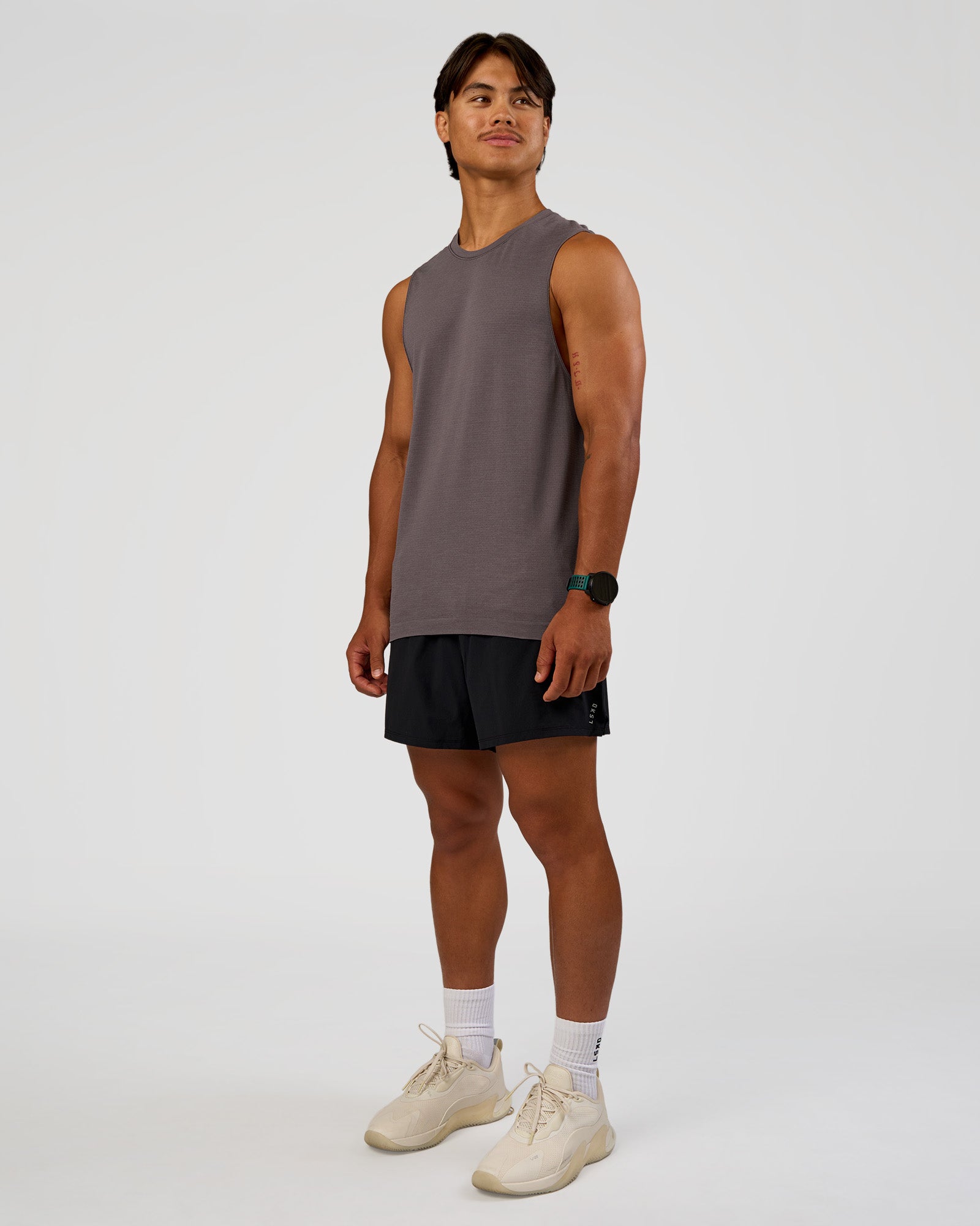 Man wearing AeroFLX+ Seamless Muscle Tank - Duskstone/Duskstone | Model:George | Size:M